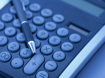 Pen and calculator illustrating cost benefits of 3D printing