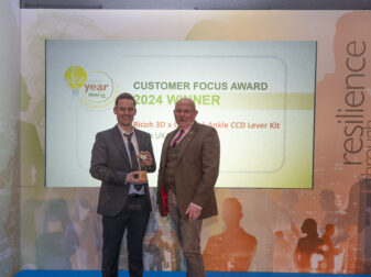 Ricoh 3D's Senior Engineer and Medical Lead, Richard Minifie collecting the IdeasUK 'Customer Focus' award.